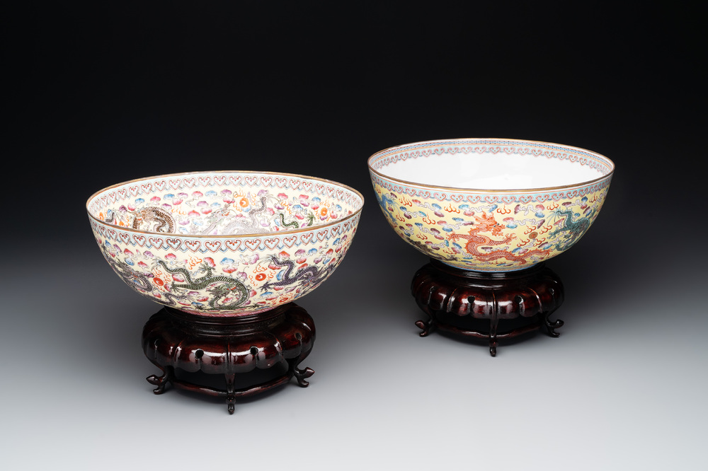 Two Chinese eggshell famille rose 'dragon' bowls on wooden stands, Qianlong mark, 20th C.