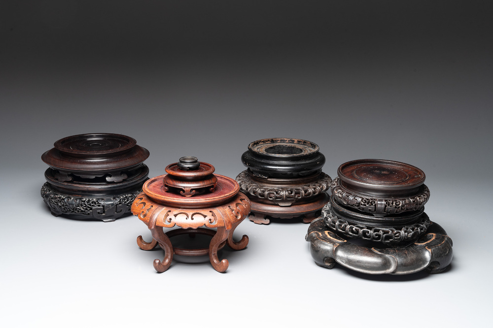 A collection of 11 Chinese wooden stands, 19/20th C.