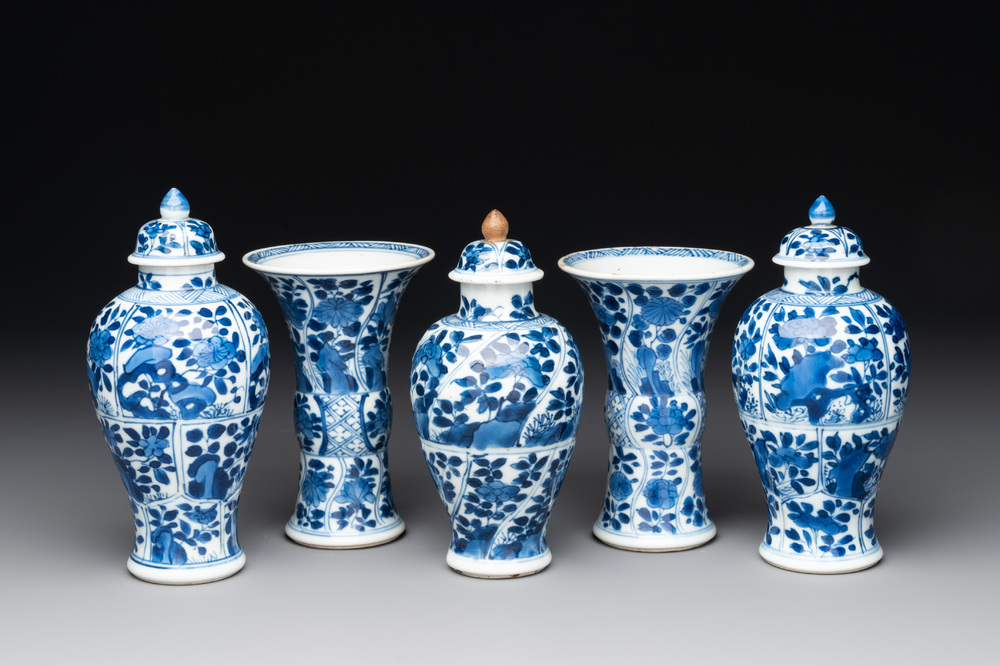 A Chinese blue and white garniture with five vases, Kangxi