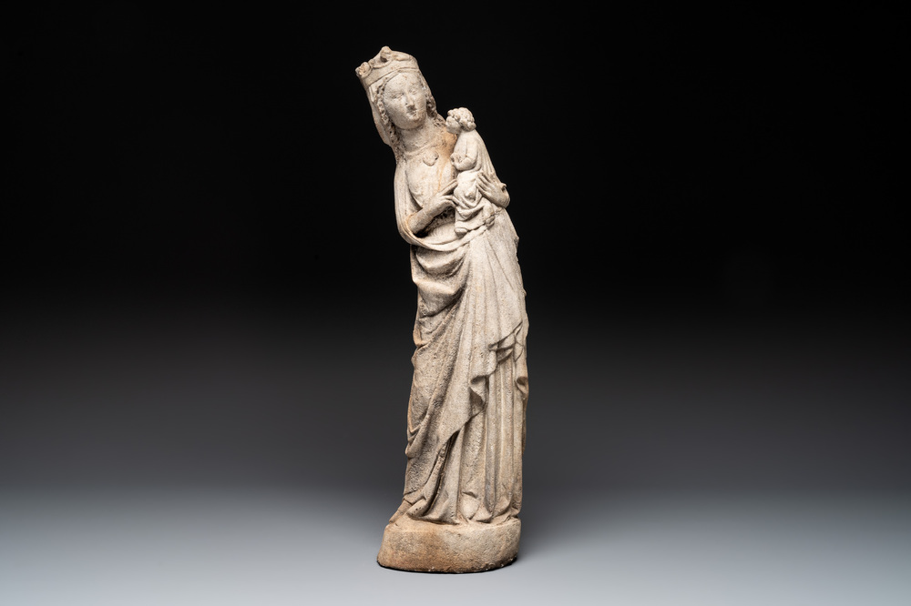 A stone sculpture of Madonna with Child, France, 14th C.