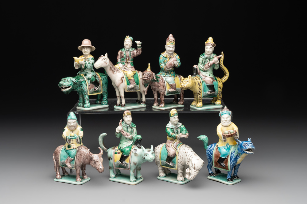 Eight Chinese verte biscuit figures riding mythical animals, 19/20th C.