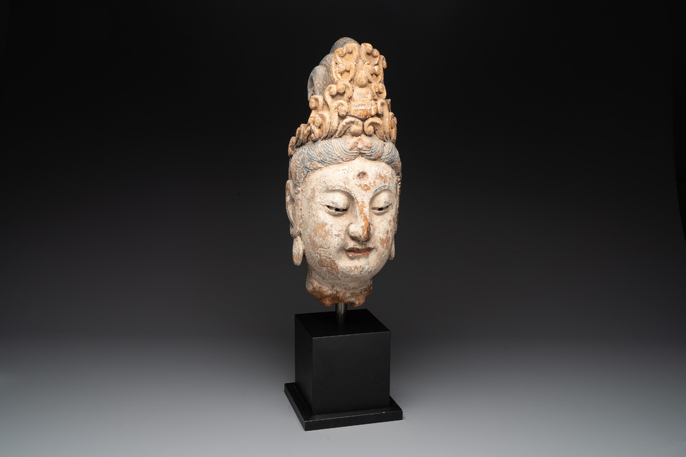 A large Chinese polychromed wooden head of Guanyin, probably Ming