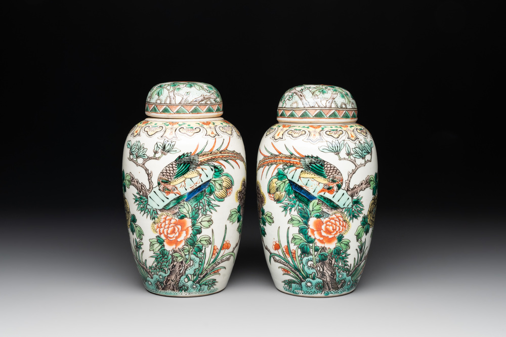 A pair of Chinese famille verte 'pheasant among flowering branches' vases and covers, 19th C.