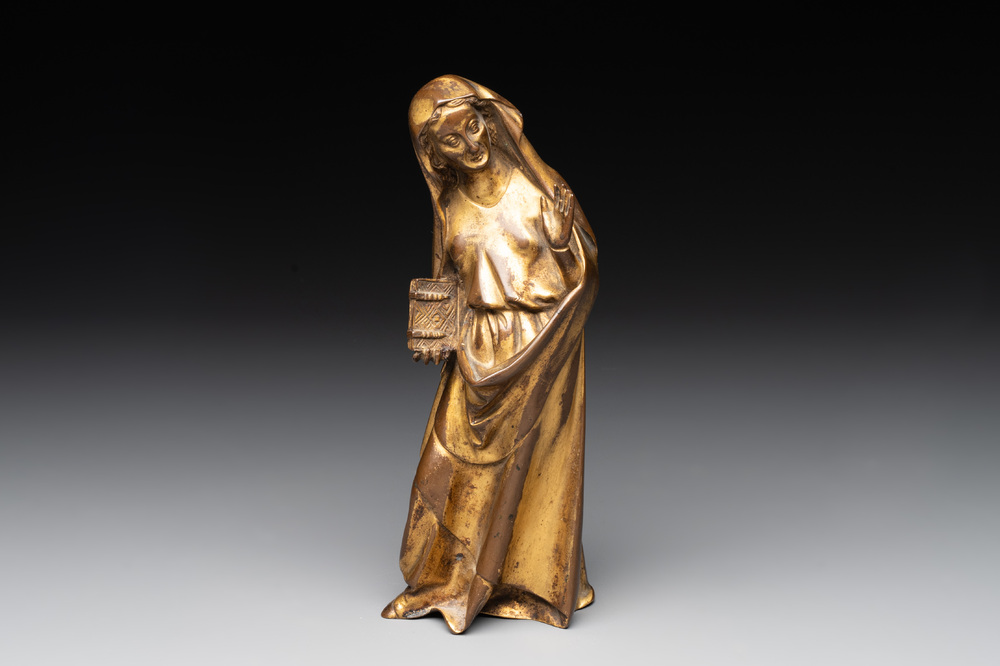 A gilt bronze figure of the Virgin of the Annunciation, probably 15th C.
