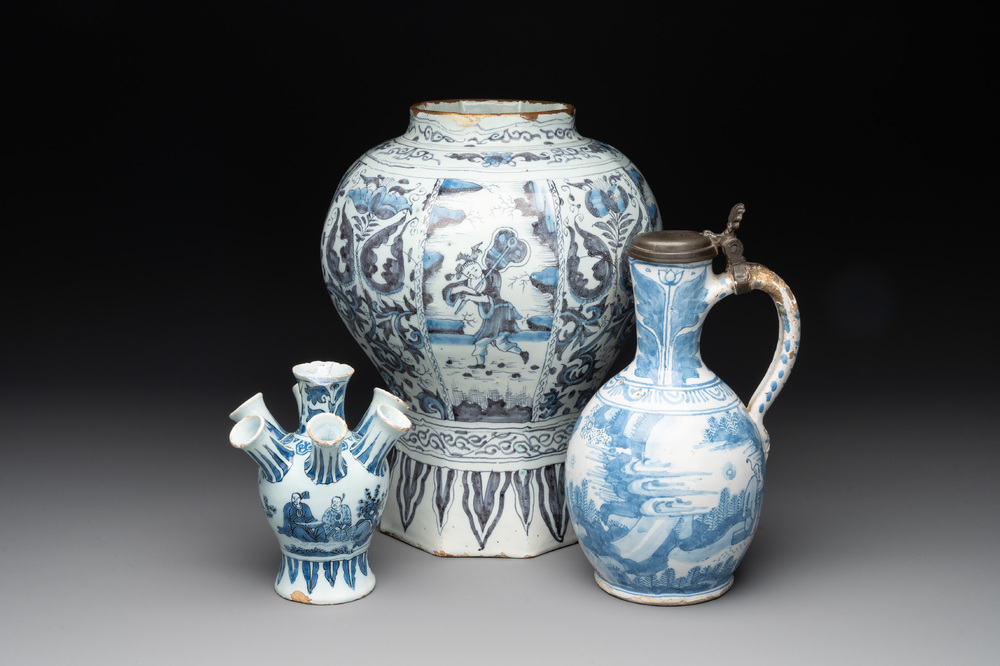 A blue and white Dutch Delft 'chinoiserie' tulip vase, a baluster vase and a pewter-mounted jug, 17th C.