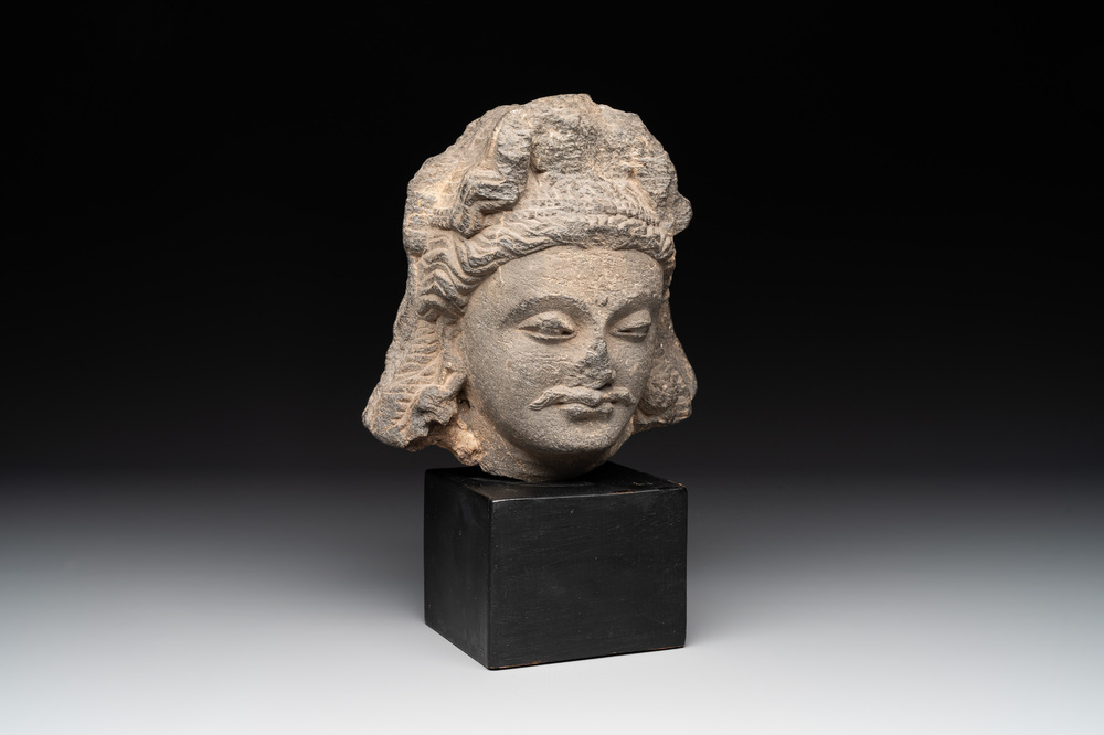 A Gandhara grey schist relief fragment of a Bodhisattva head, 2nd/3rd C.