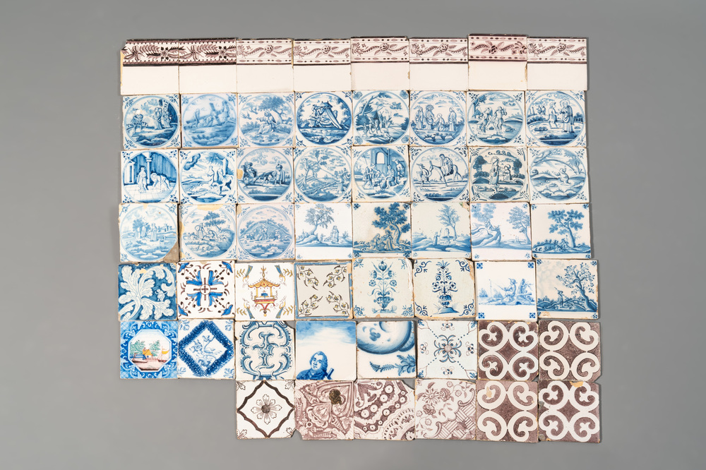 A collection of 54 blue, white, manganese and polychrome Dutch Delft tiles, 17/18th C
