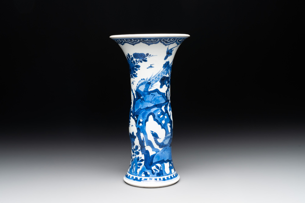 A Chinese blue and white 'gu' vase with birds amongst flowering branches, Kangxi