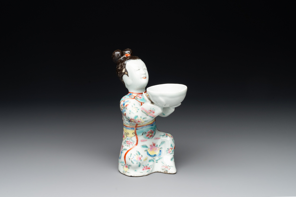 A Chinese famille rose figure of a lady presenting a bowl, Qianlong