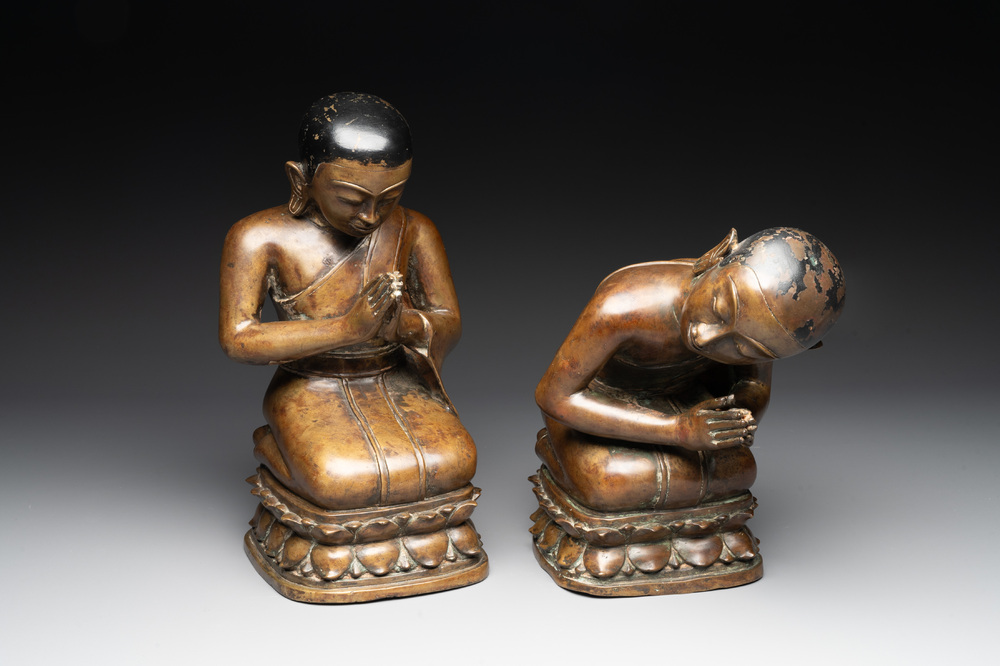 Two Burmese partly lacquered bronze praying monks, 18/19th C.