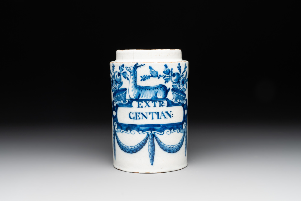 A rare blue and white Dutch Delft albarello with a recumbent deer, inscribed 'EXTR:GENTIAN:', 18th C.