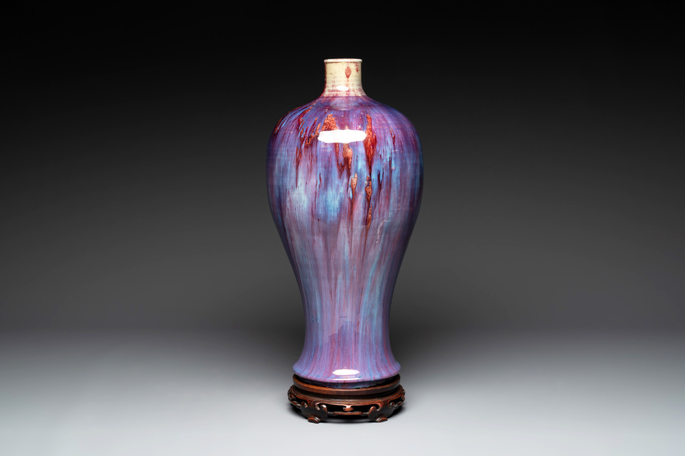 A Chinese flamb&eacute;-glazed 'meiping' vase on wooden stand, 18/19th C.