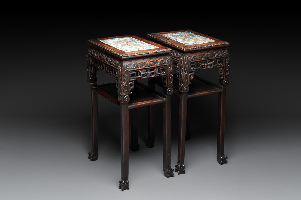 A pair of Chinese famille verte 'narrative' plaques mounted in hardwood tables, 19th C.