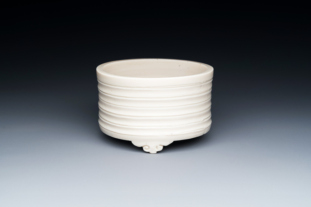 A Chinese Dehua blanc de Chine tripod censer, Kangxi