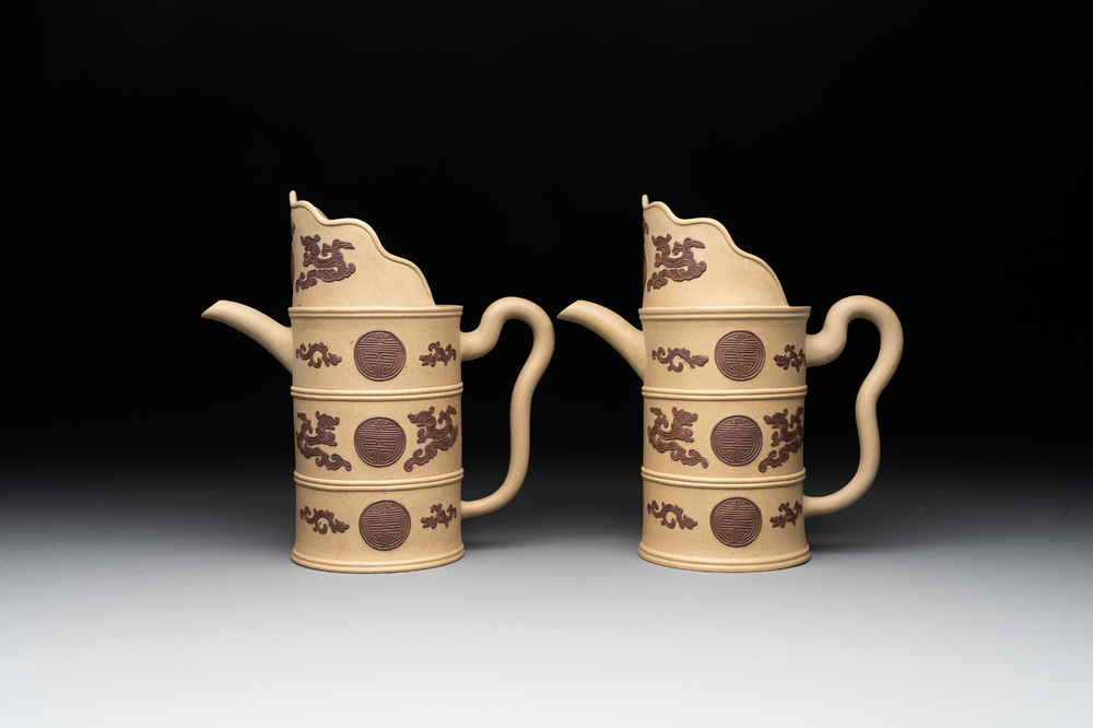 A pair of very rare Chinese Yixing stoneware 'duomuhu' ewers and covers, Kangxi
