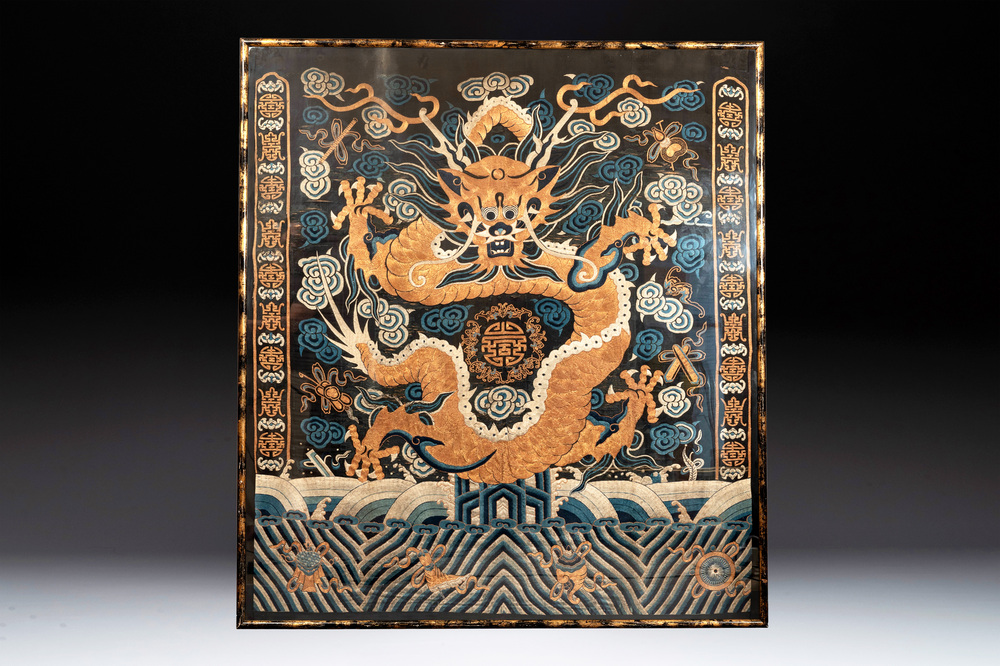 A Chinese embroidered silk tapestry with a five-clawed dragon among clouds and bajixiang, 18/19th C.