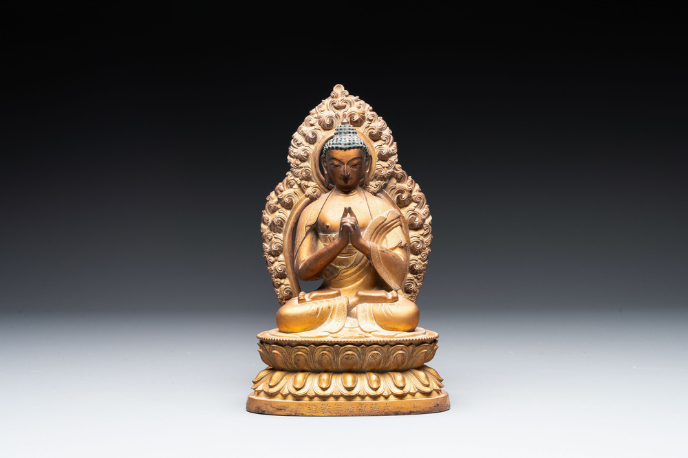 A fine Chinese gilt bronze Buddha, Qianlong mark and of the period