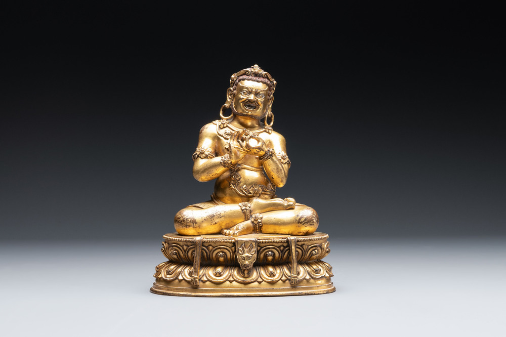 A Sino-Tibetan gilt bronze Virūpa, 19th C.