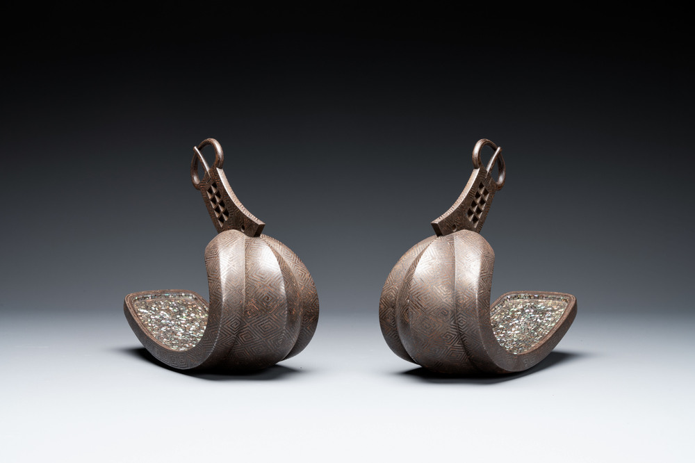 A pair of Japanese steel 'abumi' stirrups with silver and mother-of-pearl-inlay, Edo, 18/19th C.