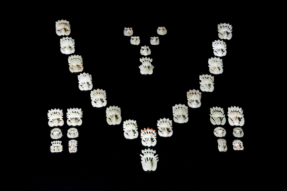 34 Chinese white and celadon jade phoenix-form hat ornaments, 19th C.