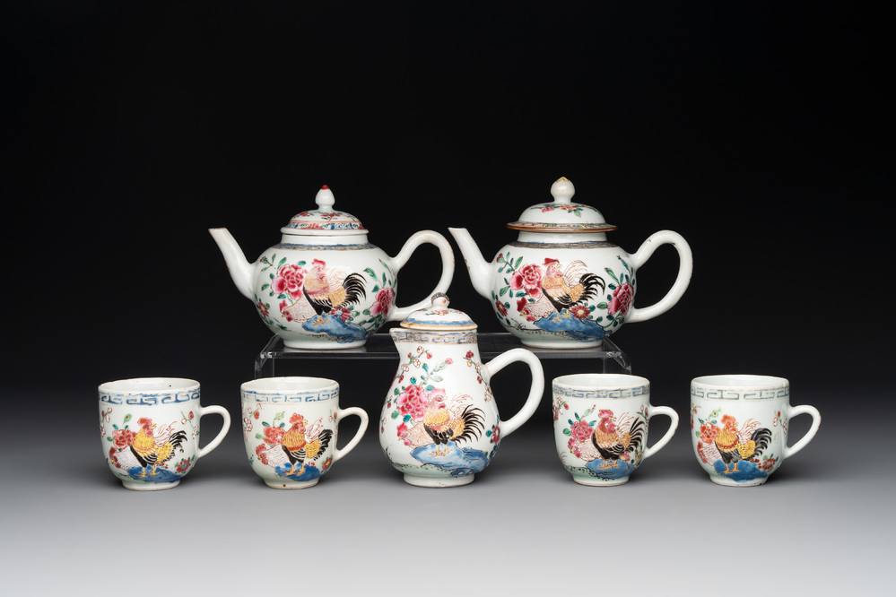 Two Chinese famille rose 'rooster' teapots, a milk jug and four handled cups, Yongzheng