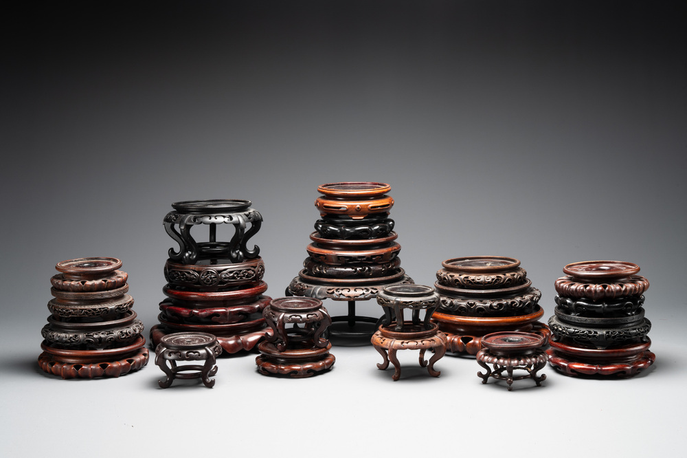 A collection of 26 Chinese wooden stands, 19/20th C.