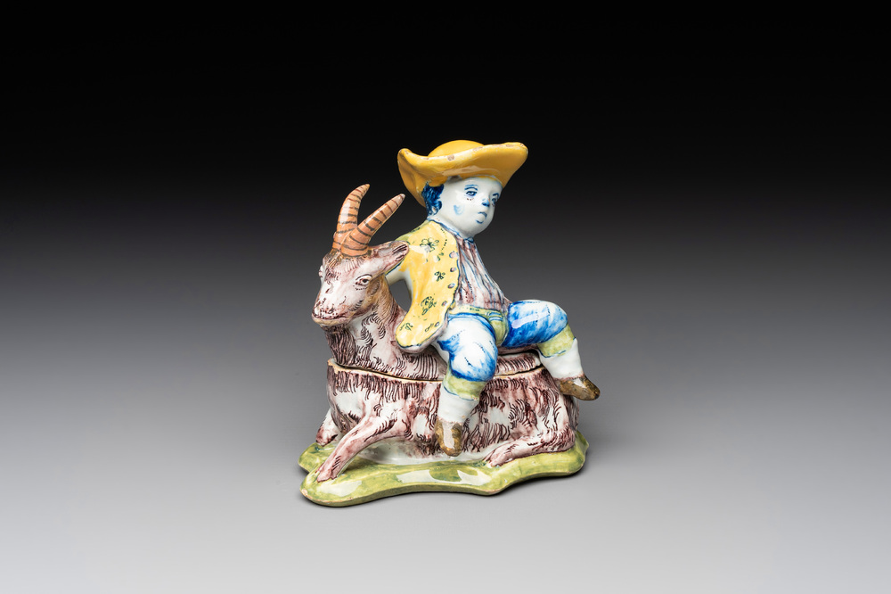 A polychrome Dutch Delft butter tub and cover in the shape of a buckrider, 18th C.