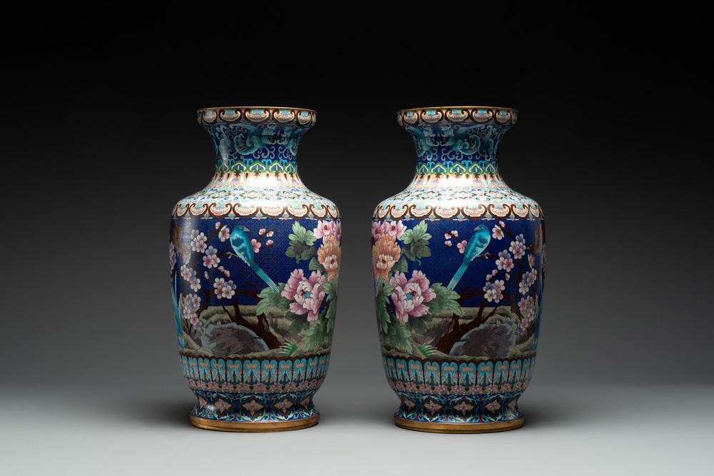 A pair of Chinese cloisonn&eacute; vases with birds among flowering branches, 20th C.