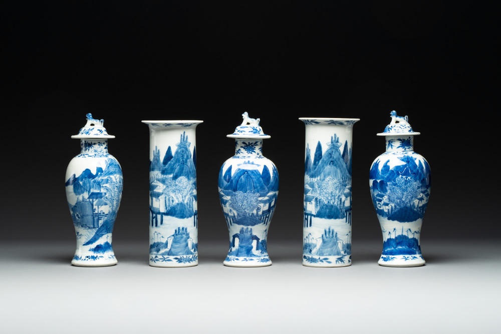 A Chinese blue and white garniture of five vases with river landscapes, 19th C.
