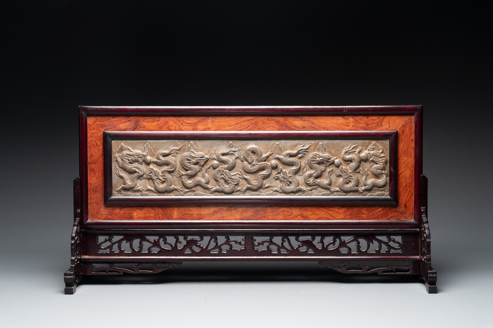 A Chinese wooden table screen with a carved stone 'dragon' plaque, 20th C.