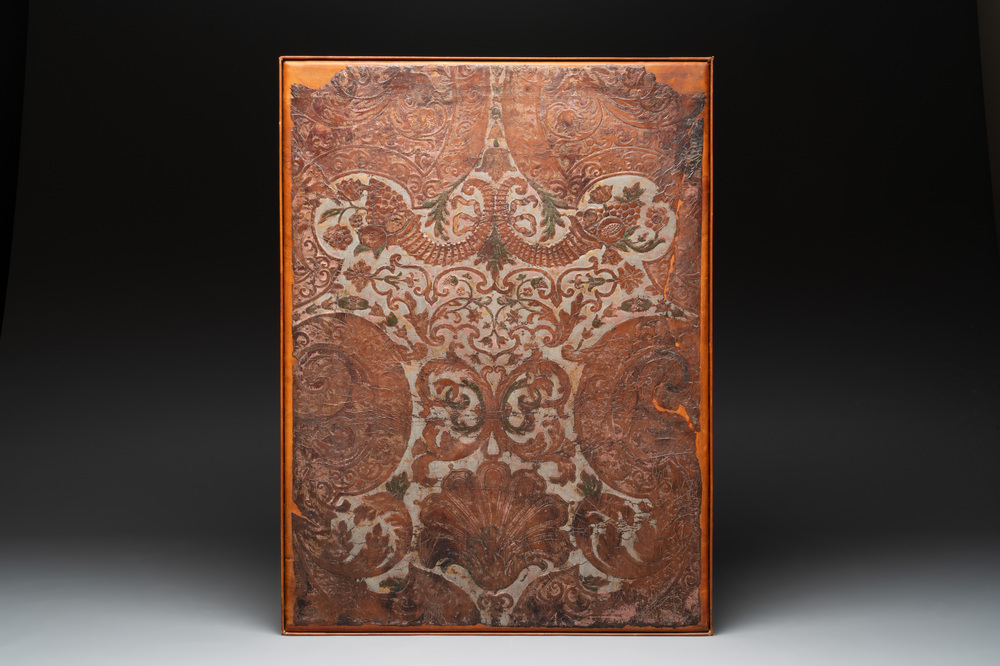 A gold leather fragment with floral design mounted on a wooden panel, Mechelen, 18th C.
