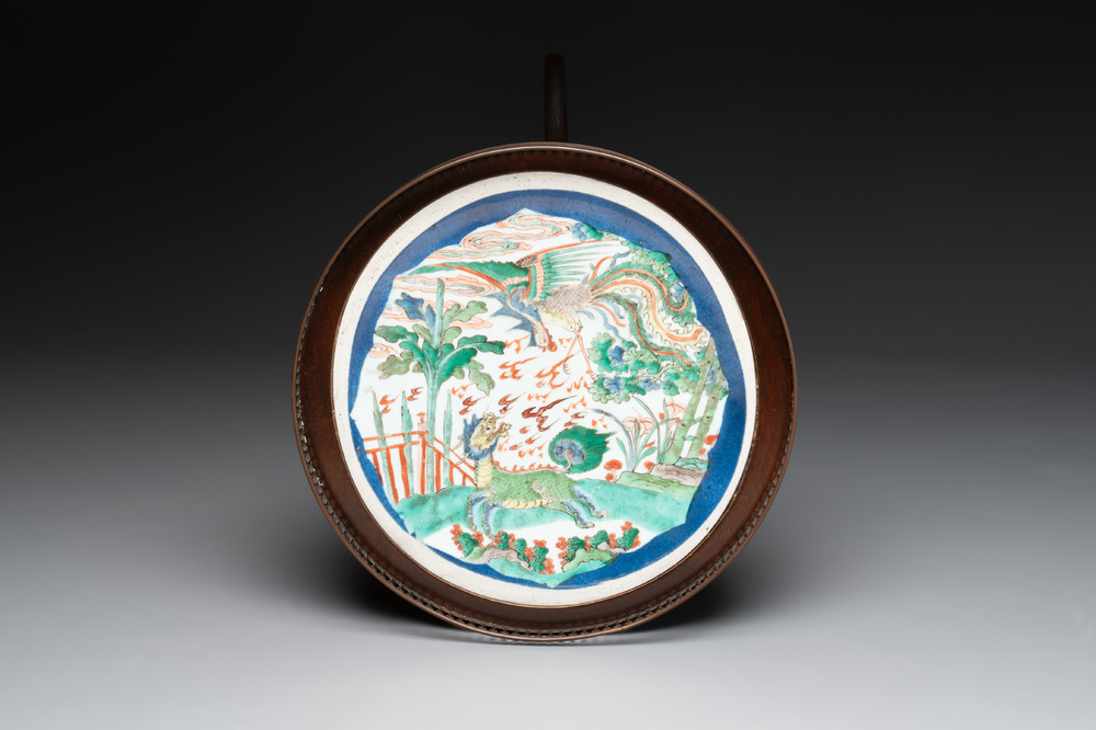 A Chinese famille verte powder-blue-ground 'qilin and phoenix' dish mounted as gu&eacute;ridon, Kangxi and later
