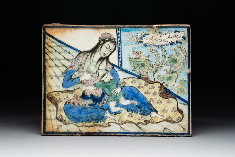 A polychrome Qajar pottery 'breastfeeding' tile, Iran, 19th C.