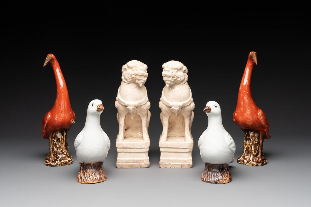 A pair of Chinese white-glazed Buddhist lions, a pair of doves and a pair of iron-red-decorated cranes, Ming and later