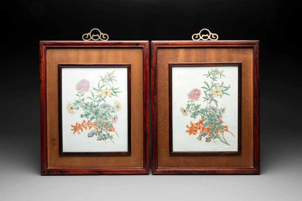 A pair of Chinese famille rose plaques in wooden frames, 20th C.