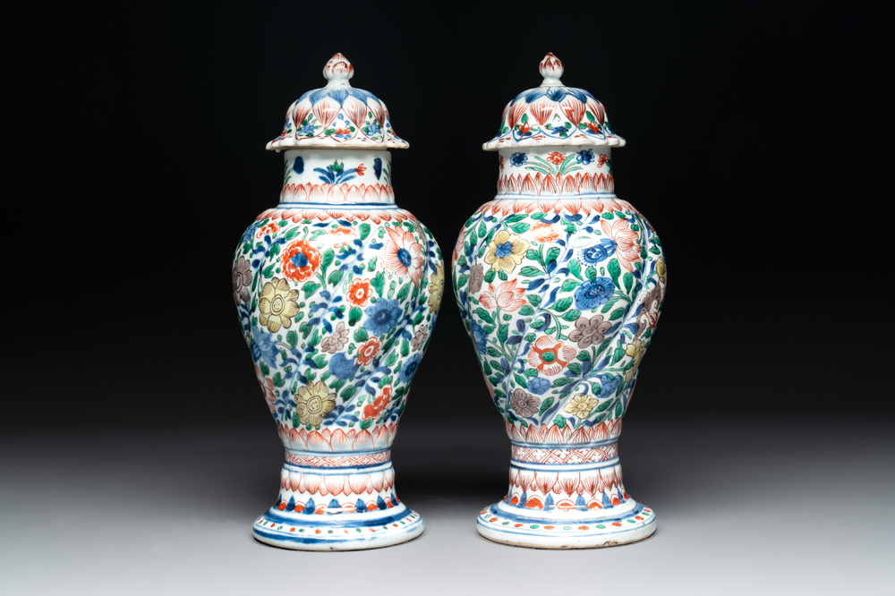 A pair of Chinese famille verte vases and covers with floral design, Kangxi
