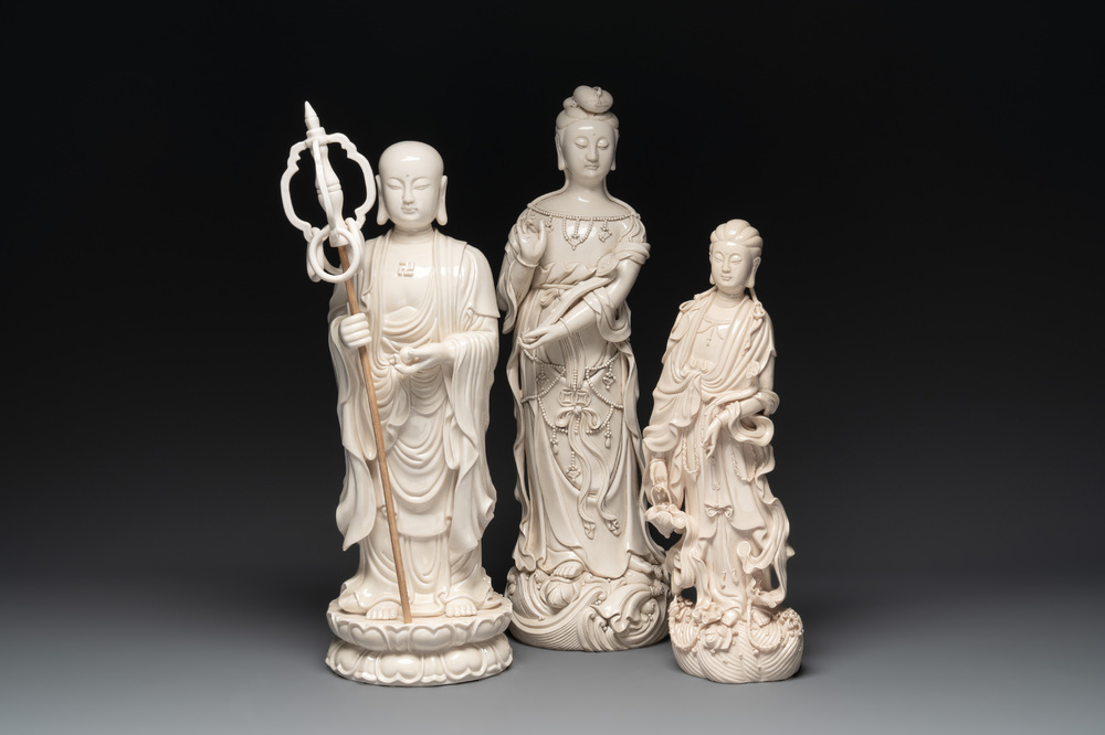 Three Chinese Dehua blanc de Chine figures of Guanyin and a monk, He Chaozong 何朝宗 and Dehua 德化 mark, 20th C.