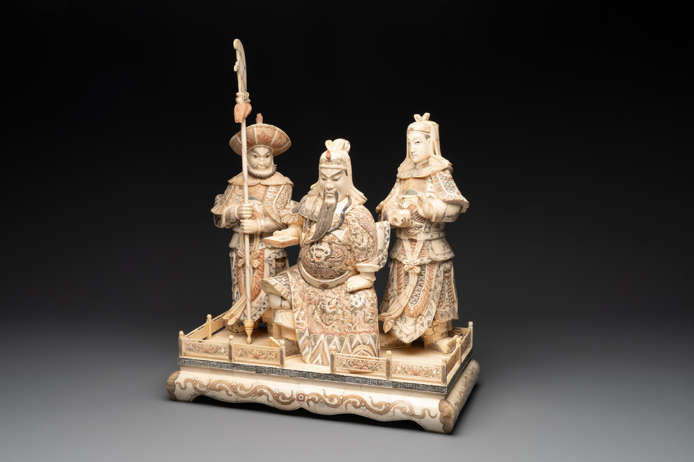 A Chinese bone-veneered group of Guandi and his attendents, 20th C.