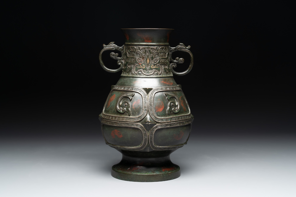 A Chinese archaistic gold- and silver-inlaid bronze vase with pseudo-rust patina, 19th C.