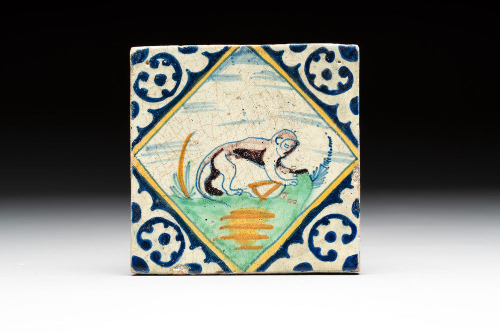 A polychrome Dutch Delft maiolica 'monkey' diamond tile, late 16th C.