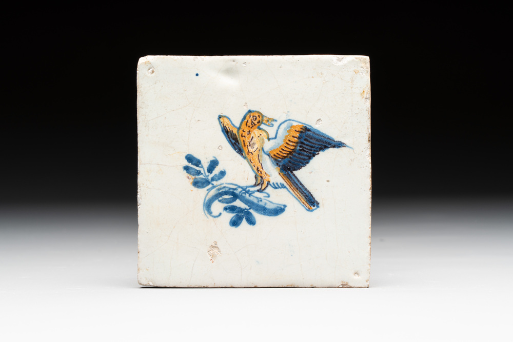 A polychrome Dutch Delft 'bird on a branch' tile, 17th C.