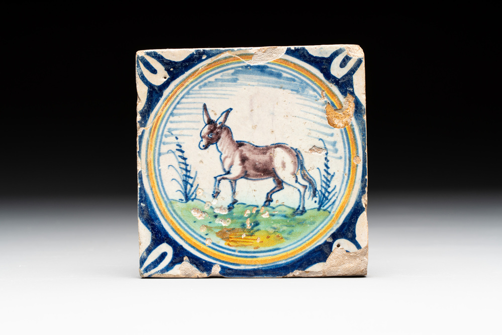 A polychrome Dutch Delft maiolica 'donkey' medallion tile, late 16th C.