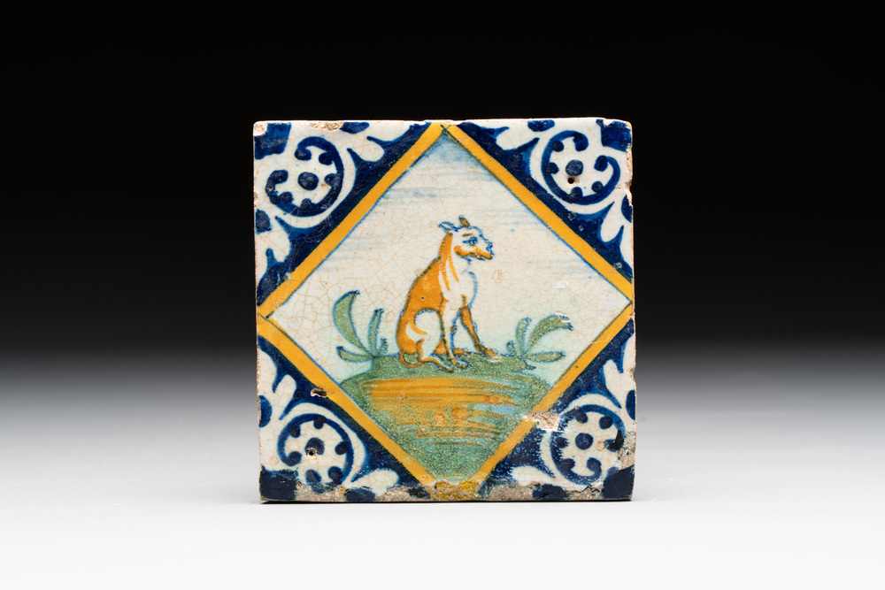 A small polychrome Dutch Delft maiolica 'dog' tile, late 16th C.