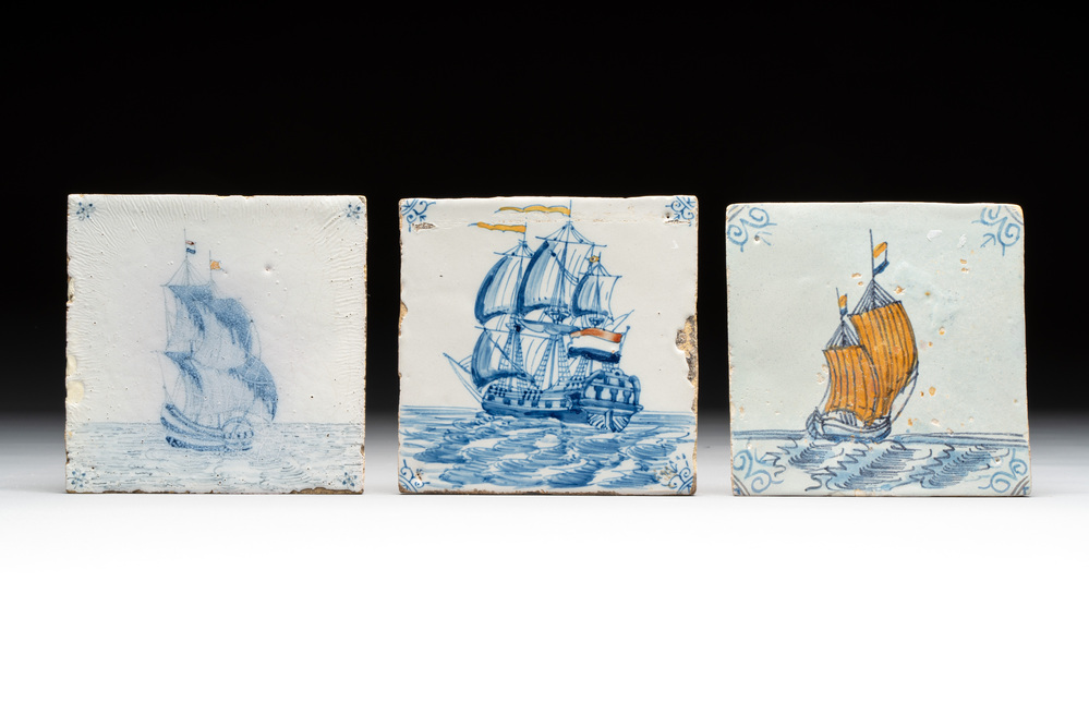 Three blue and white Dutch Delft 'ships with coloured flags' tiles, 17th C. and later
