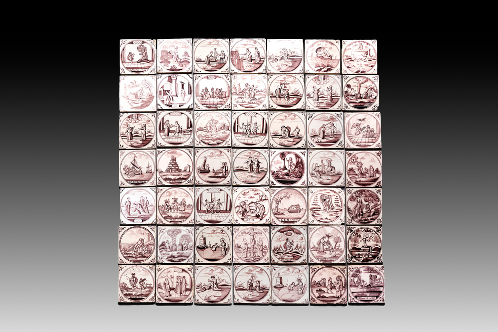 A collection of 49 manganese Dutch Delft 'biblical subject' tiles, 18th C.