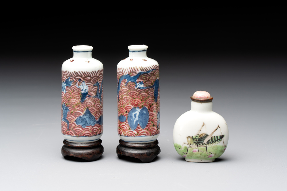 A pair of Chinese blue, white and copper-red 'mythical beasts' and a famille rose 'grasshopper' snuff bottle, Yongzheng and Daoguang mark, 19th C.