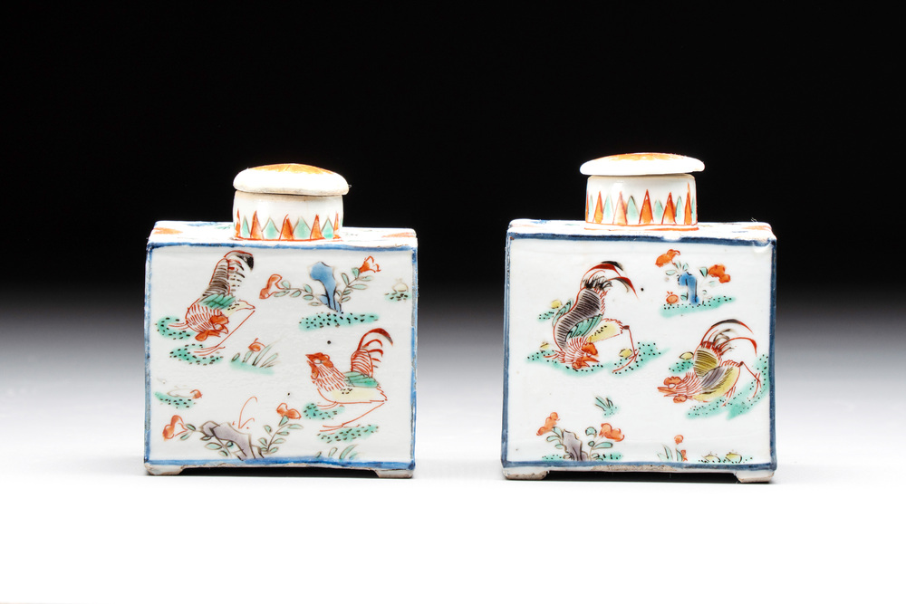 A pair of Chinese famille verte rectangular tea caddies and covers with fighting roosters, Kangxi