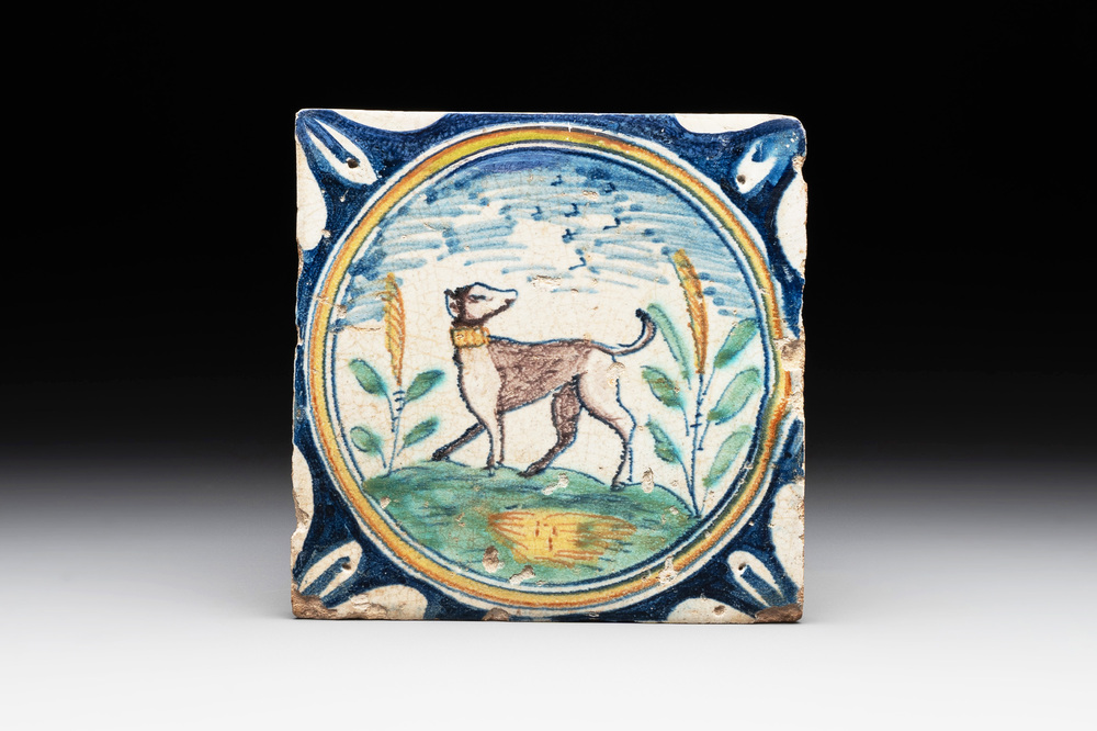 A polychrome Dutch Delft maiolica 'dog' medallion tile, late 16th C.