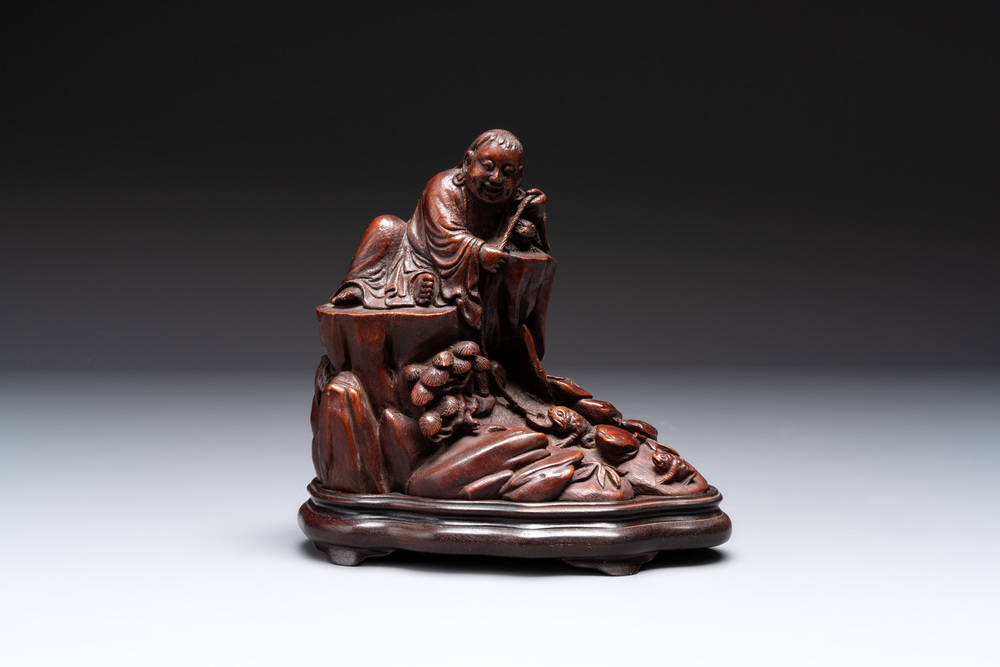 A fine Chinese carved bamboo group with Liuhai on wooden stand, 19th C.