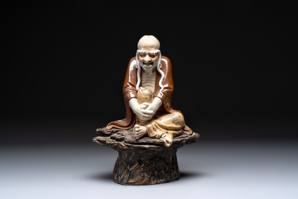 A Chinese brown- and caf&eacute;-au-lait-glazed Luohan, Zeng Longsheng 曾龍升 mark, 20th C.